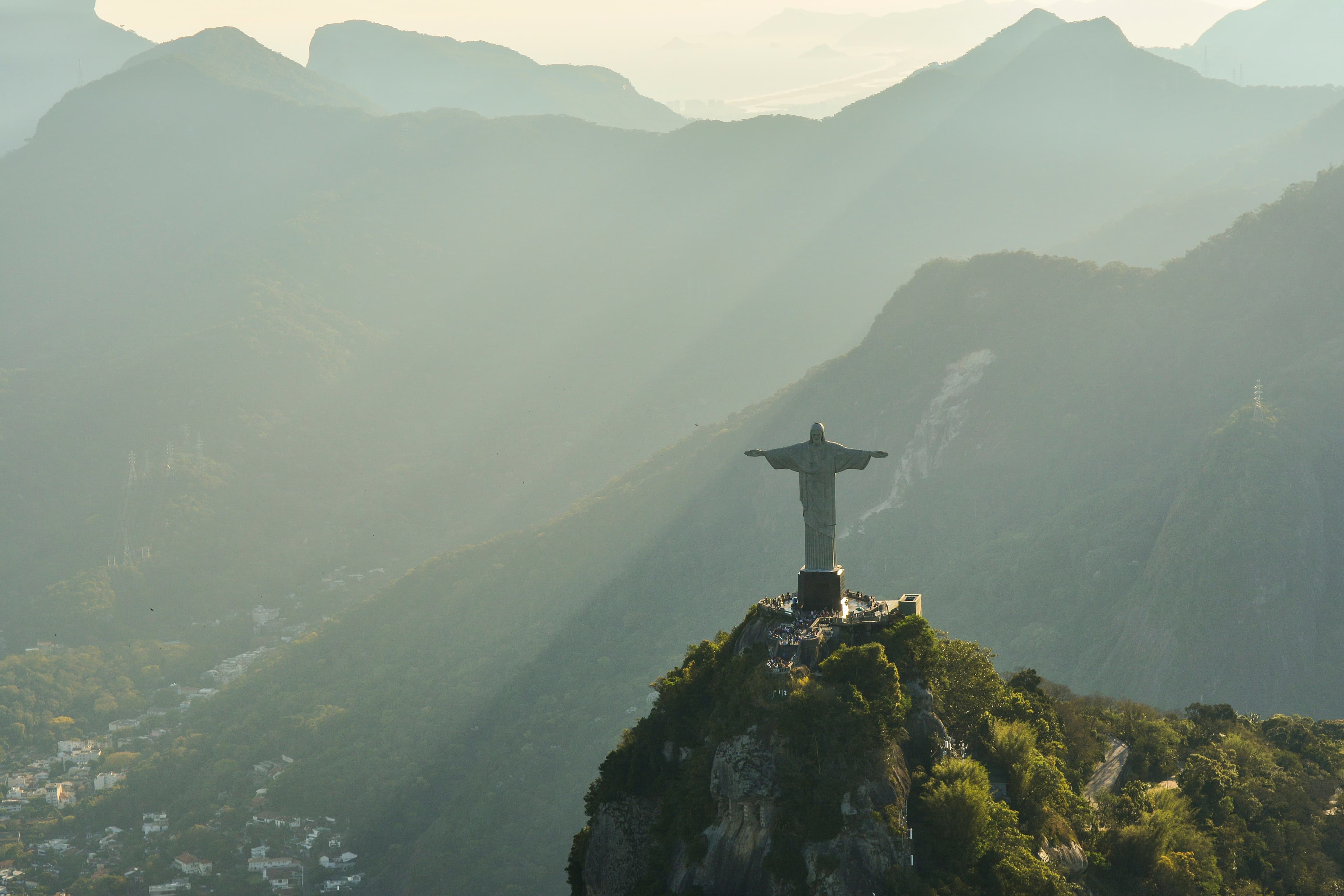 Christ the Redeemer above misty mountains in Rio de Janeiro